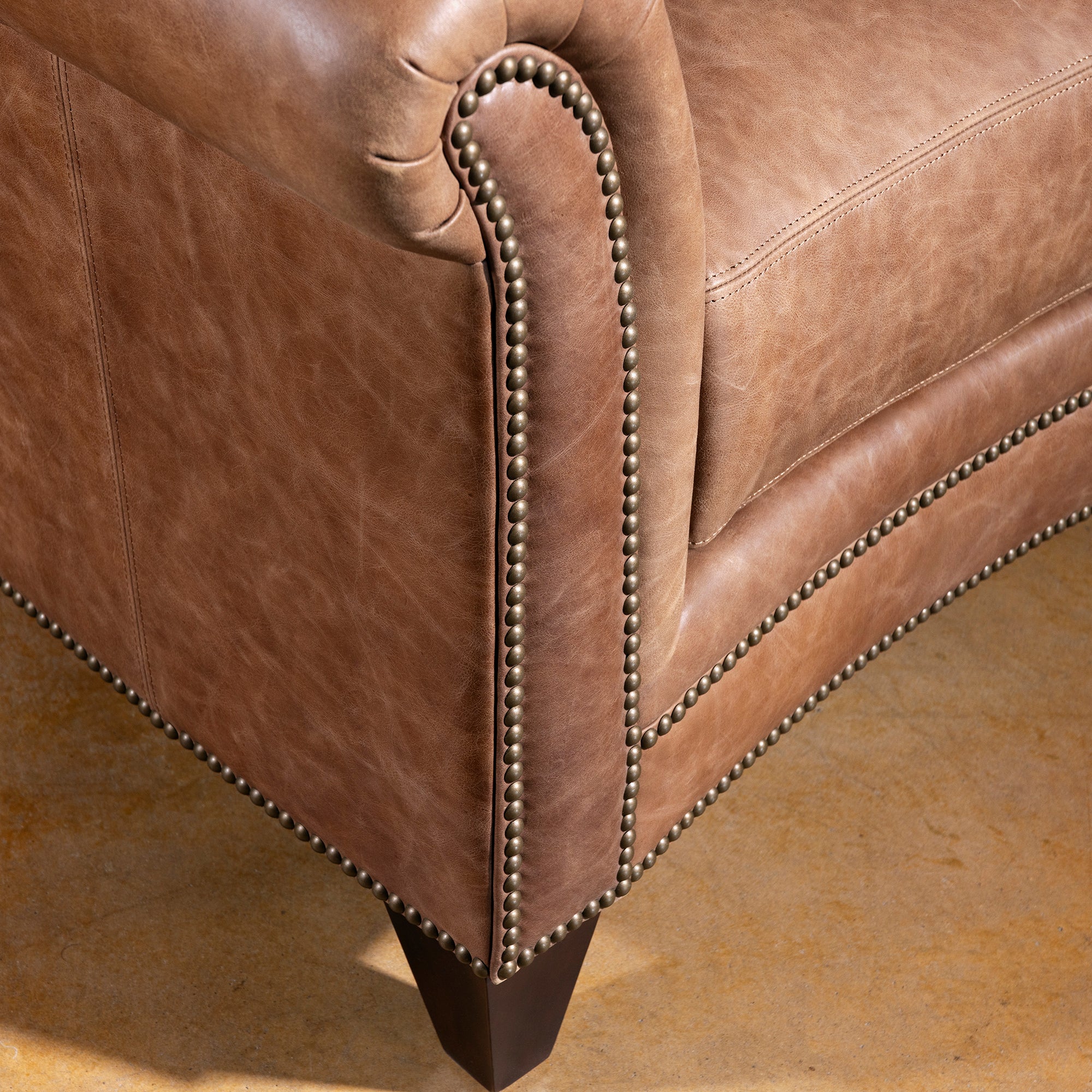 Rolled arm and nailhead trim closeup on Oakley Frontier saddle tan leather chair