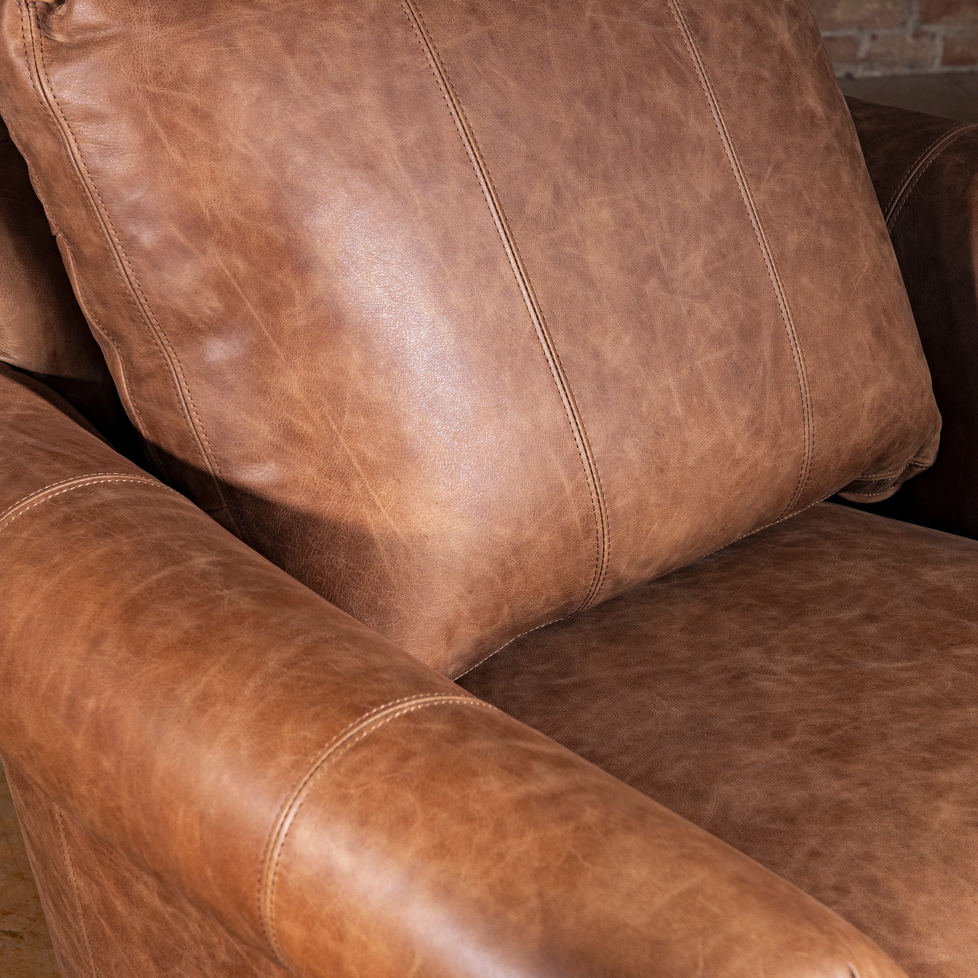 Seat and back cushion closeup on Oakley Frontier top grain leather accent chair