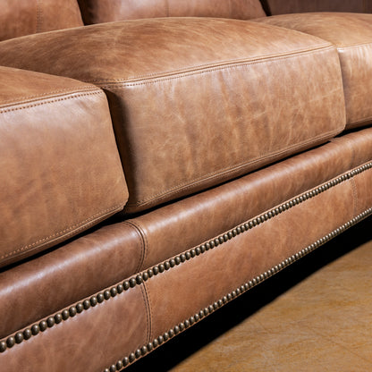 Front rail and nailhead trim closeup on Oakley Frontier top grain leather Western sofa