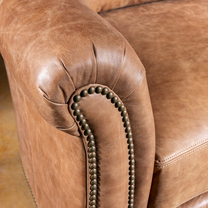 Rolled arm detail on Oakley Frontier Western leather sofa with antique nailhead trim