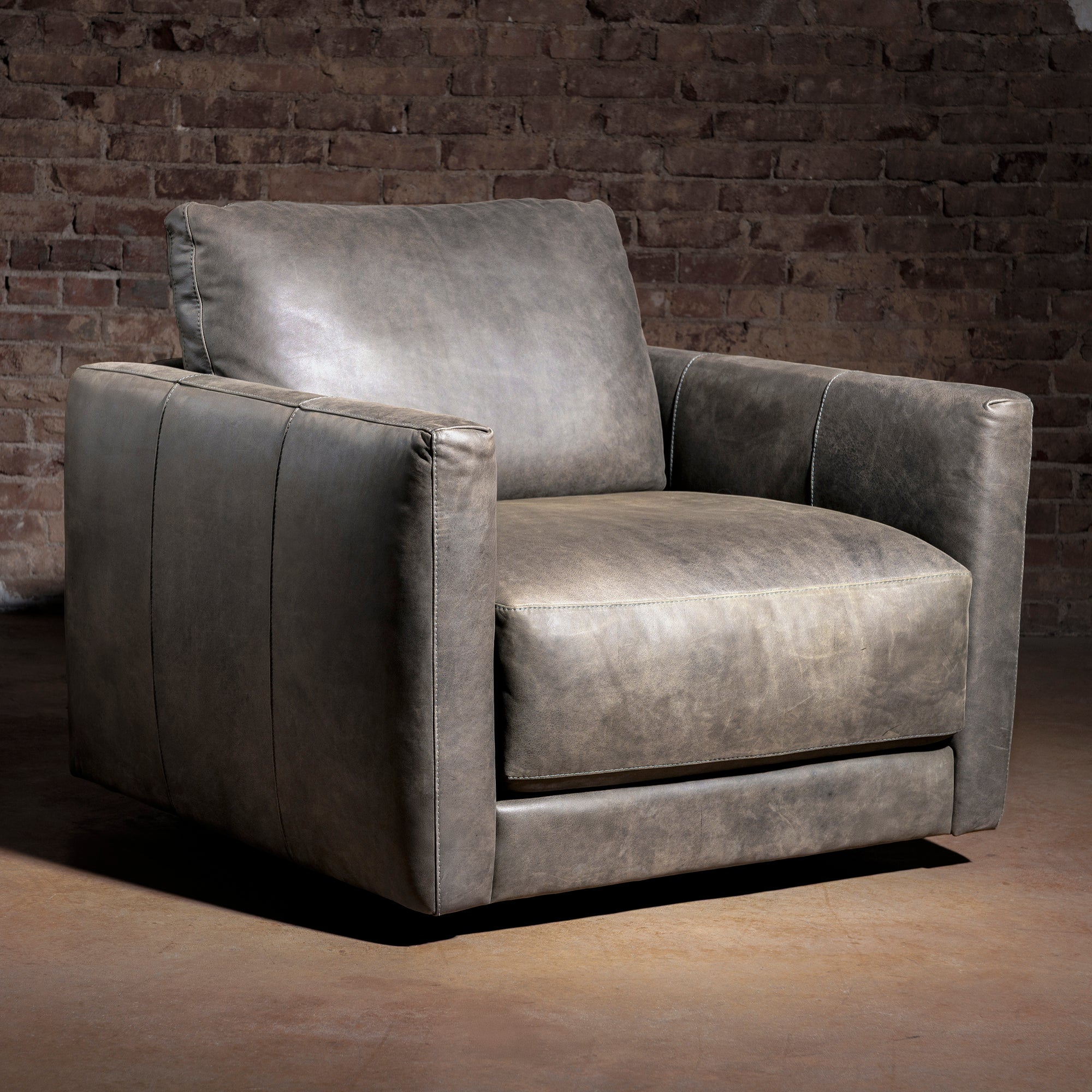 One-only Remington Cowhide Sofa & Swivel Chair Set in top-grain leather. Retail value $12,098, special bundle price $7,999. First come, first served.