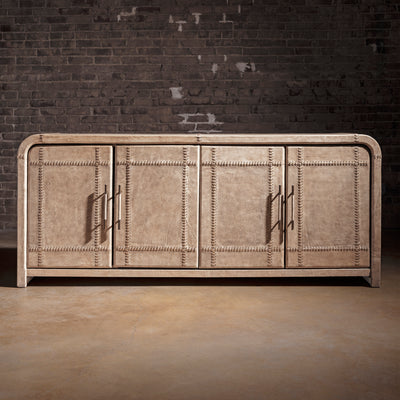 Palisade Bone Buffet western buffet front view with four leather-paneled doors, rounded corners, and modern ranch silhouette.