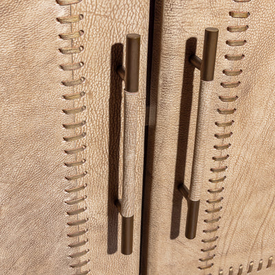 Palisade Bone Buffet western buffet handle detail with bronze-toned pulls and bone leather paneled cabinet doors.