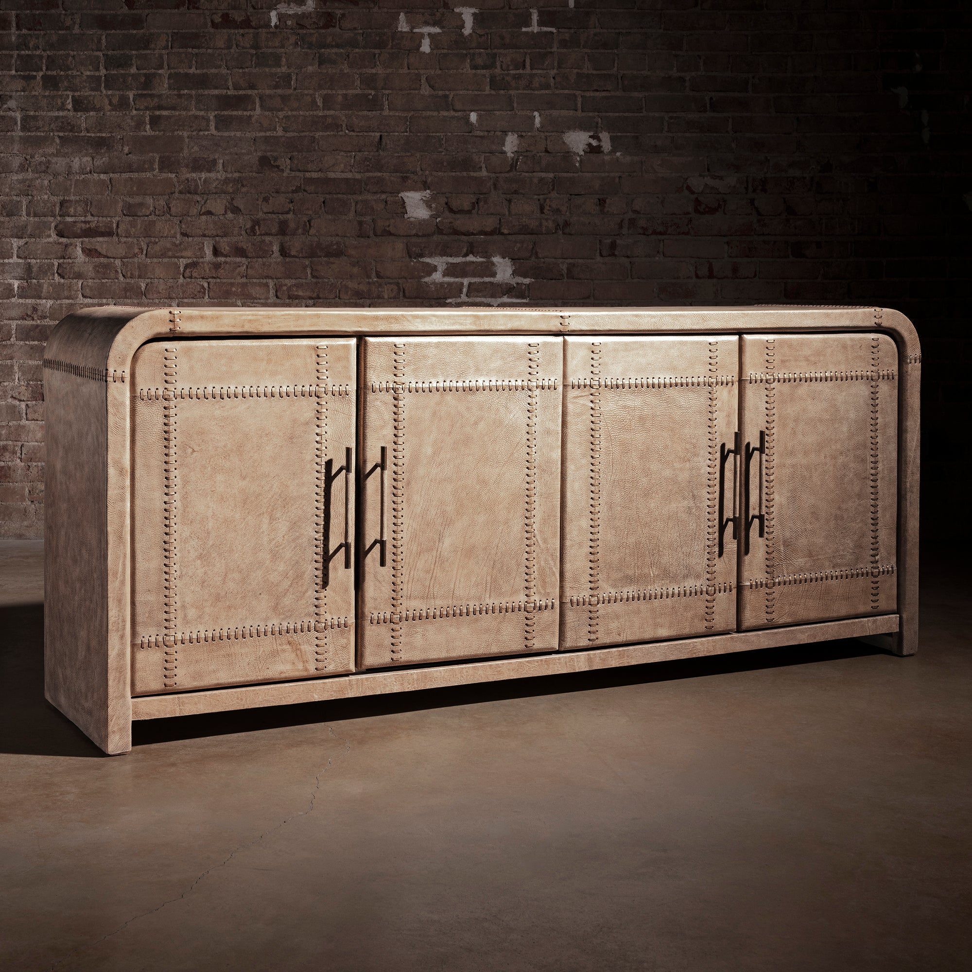 Palisade Bone Buffet western buffet with bone leather exterior, stitched panel detailing, bronze pulls, and four-door storage.