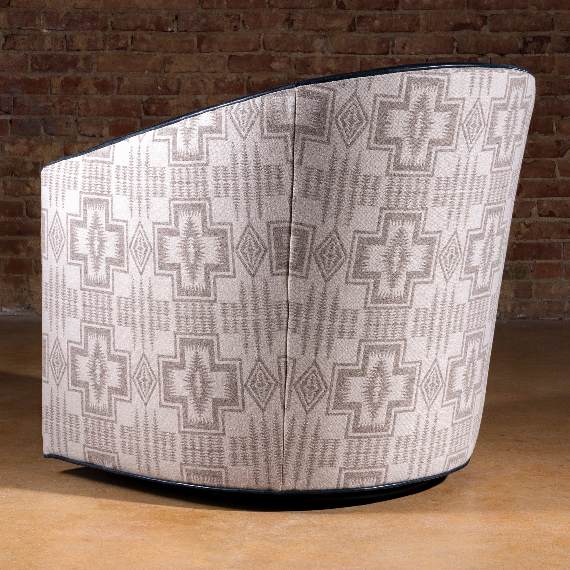 Back view of the Silver Mesa Swivel Chair showcasing Pendleton fabric cross-and-diamond motif