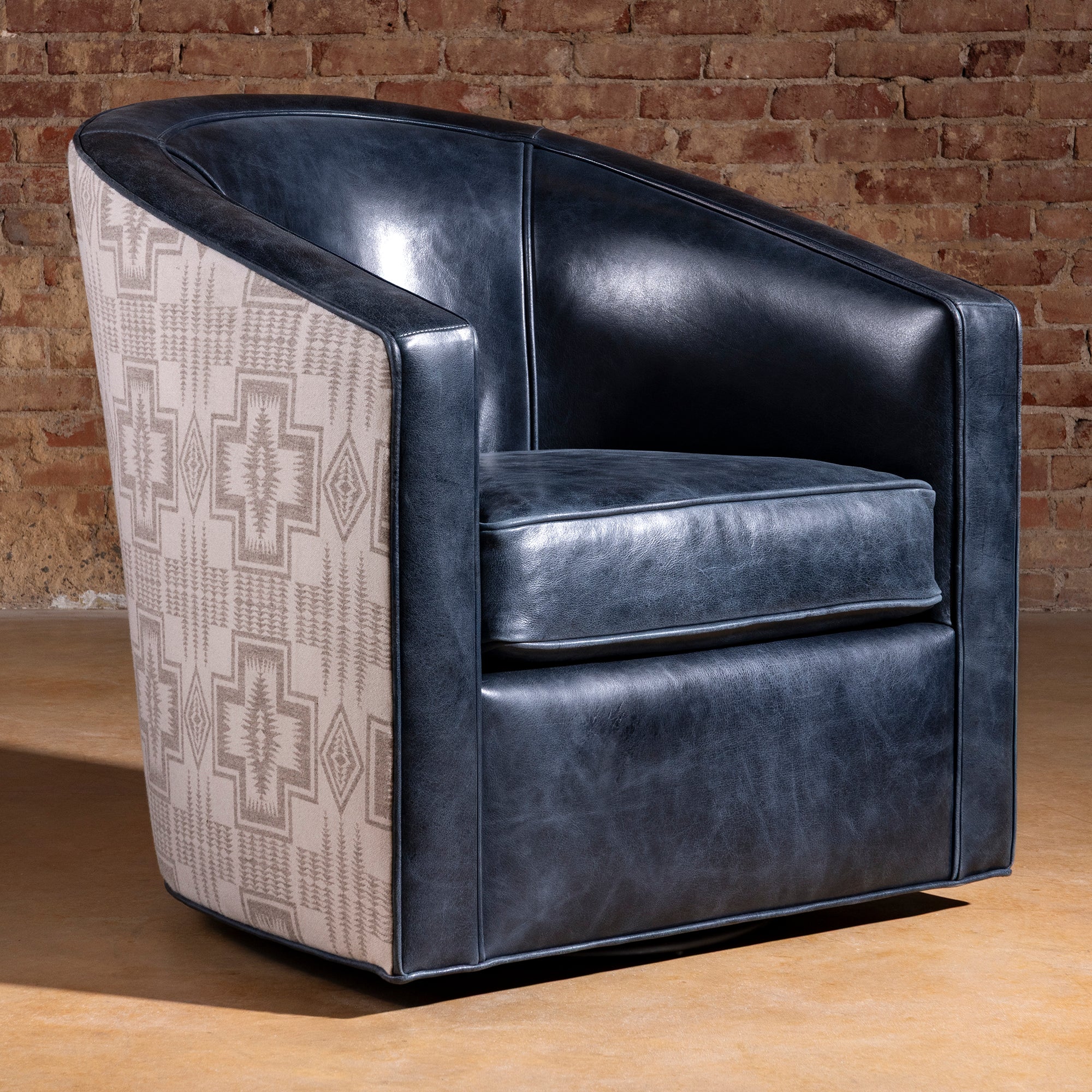 Hero image of the Silver Mesa Swivel Chair with Pendleton fabric and navy top-grain leather