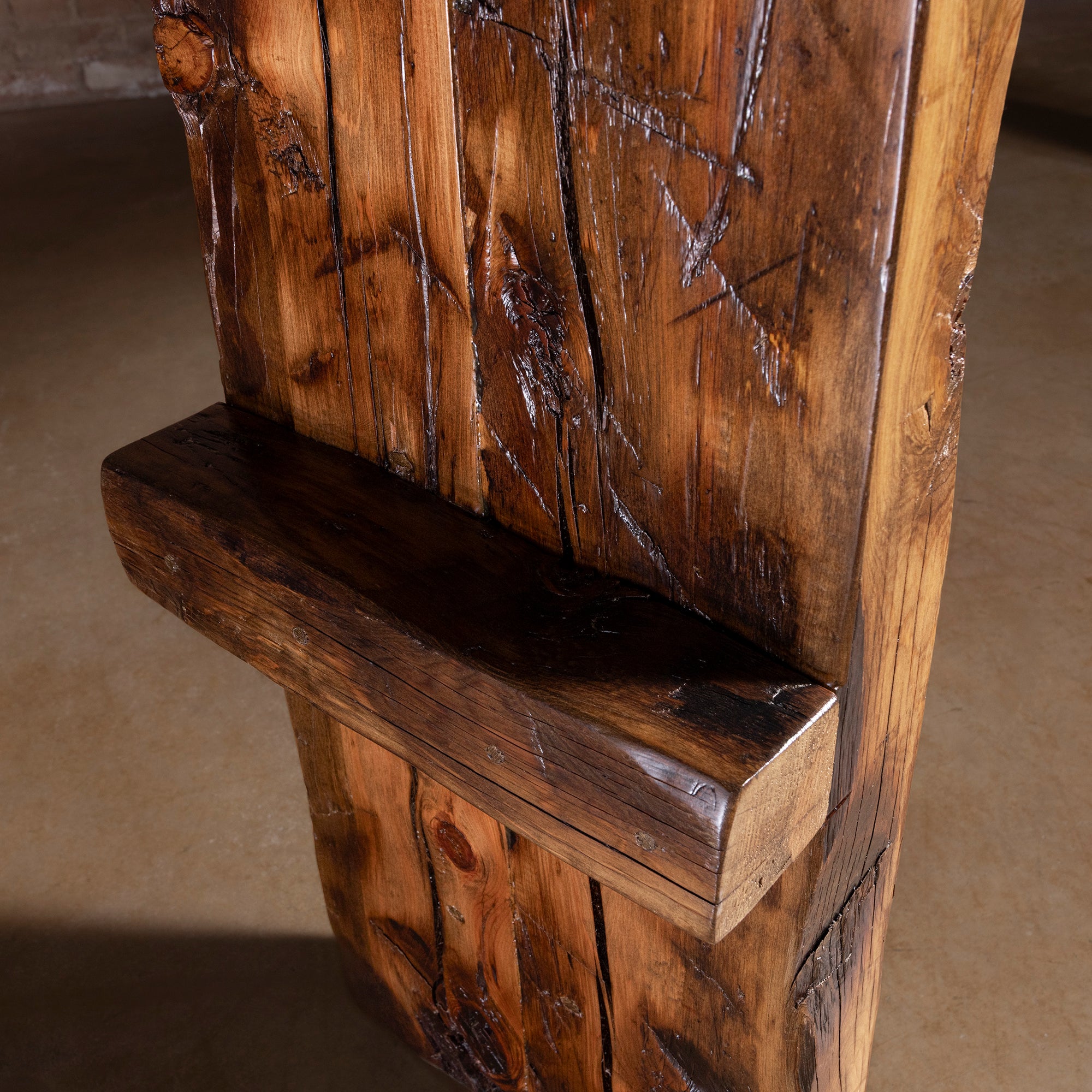 Side detail of reclaimed wood console leg showing rustic texture and patina
