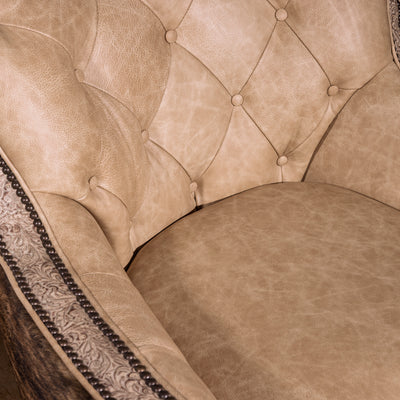 Detail of plush pearl leather seat cushion on luxury Western swivel chair