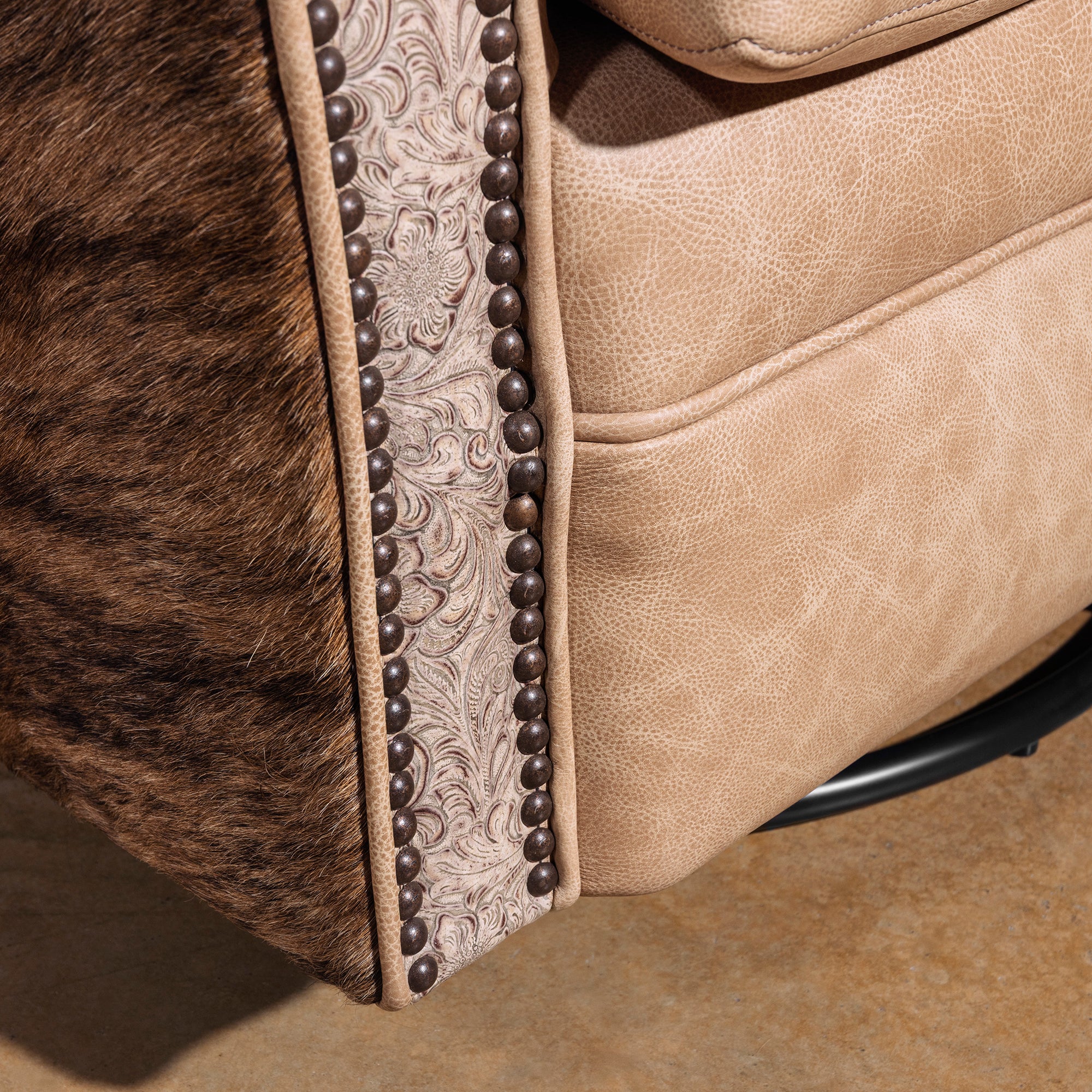 Swivel base detail on Prairie Pearl luxury Western leather cowhide chair