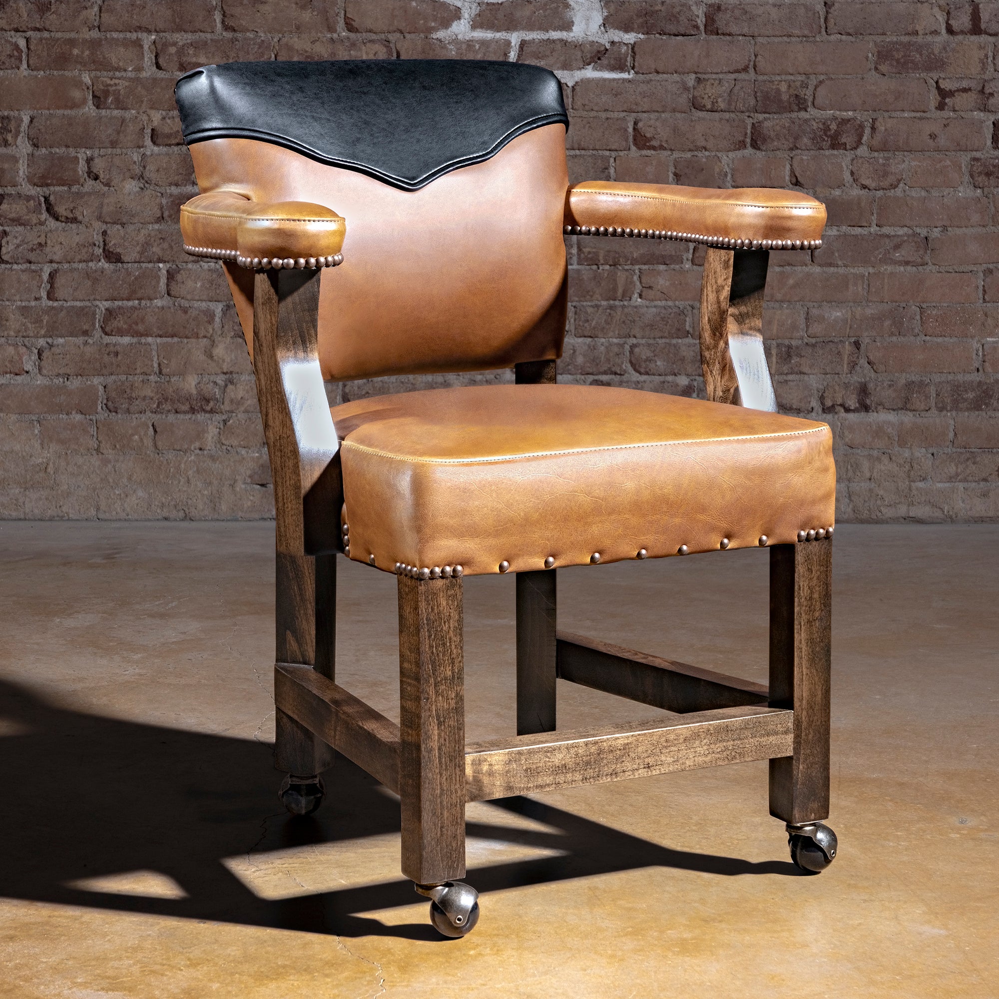 Presidio Dealer Chair western poker chair with leather arms, antique nailheads, solid alder wood legs, and rolling feet