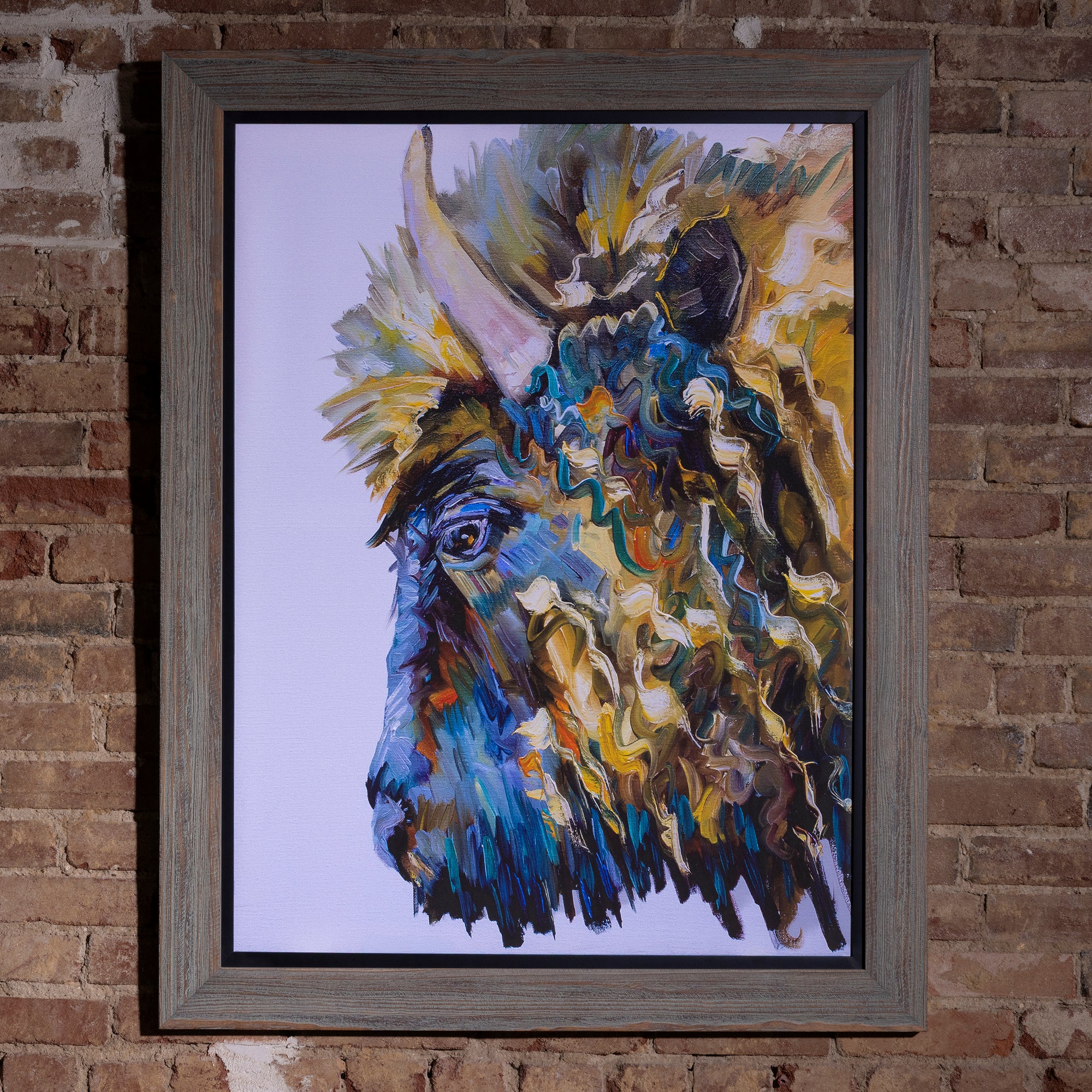 Prismatic Plains Buffalo Framed Western Wall Art western wall art with an abstract buffalo portrait, vivid blue tones, and gray wood frame