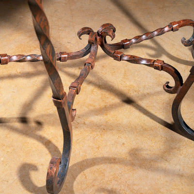 Close-up of twisted forged-iron scroll base on Ranchero Scroll Forge Western console table