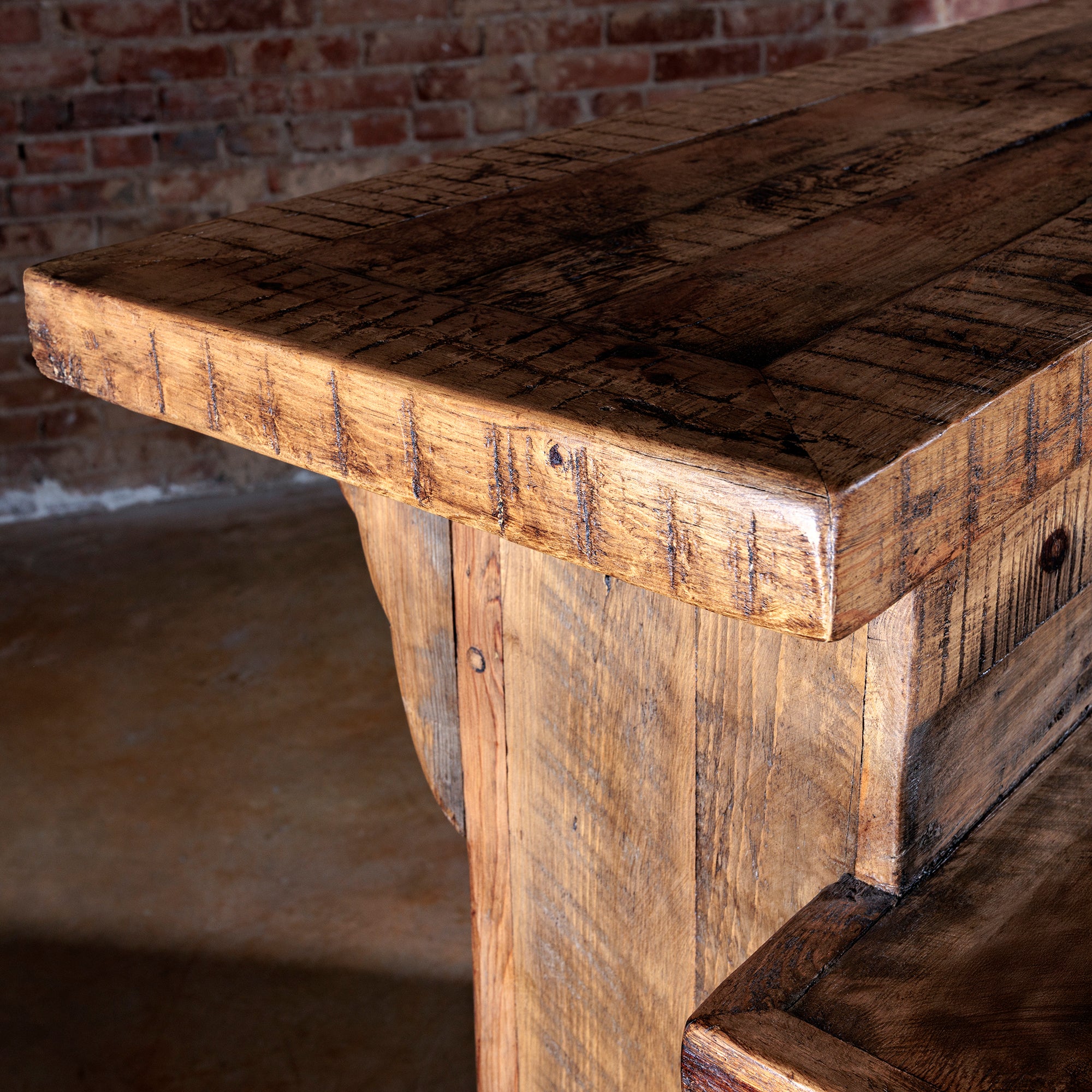 Close-up of reclaimed wood bar top with rich rustic grain