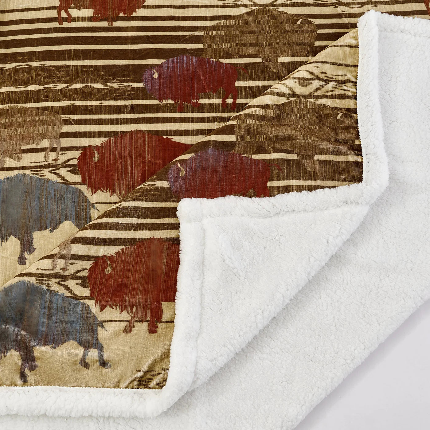 Bring the spirit of the West into any space with the Range Campfire Sherpa Throw. This lightweight blanket features a majestic buffalo herd and Aztec patterns in earthy and sky-inspired colors, and is finished with a cozy sherpa reverse for ultimate warmth and comfort. Easy-to-care-for materials make this throw an ideal, budget-friendly addition to any home.