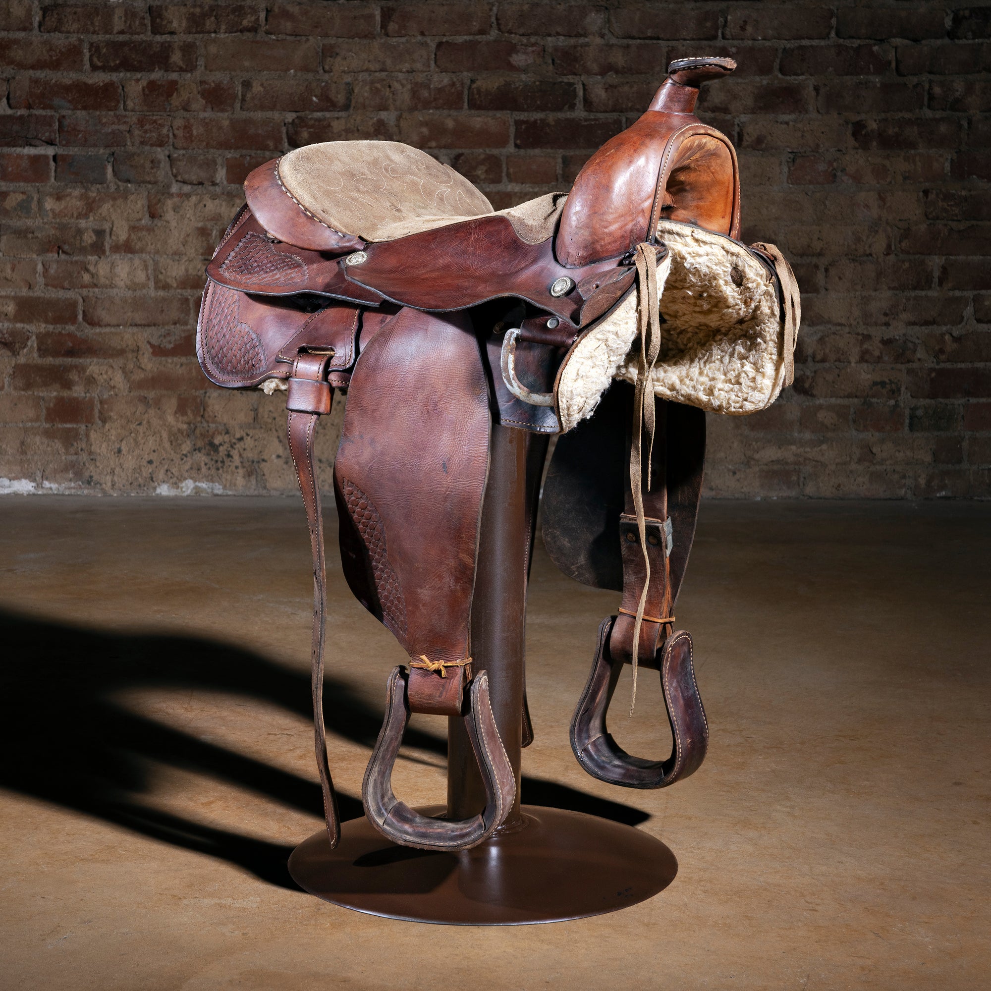 Red Rock Outrider Western saddle bar stool with real leather saddle on round iron swivel base