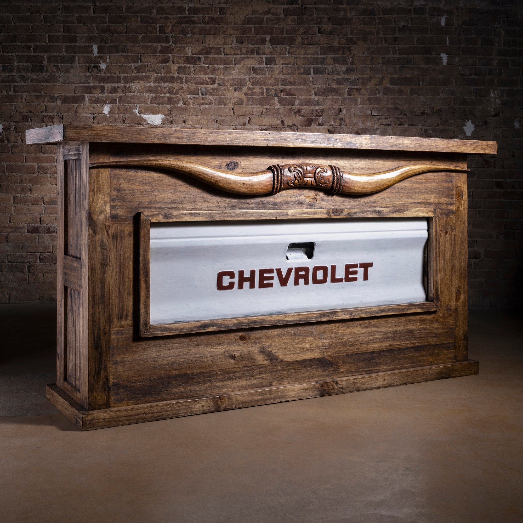 Redstone Bullhorn Tailgate Western Bar Cabinet western bar with Chevrolet tailgate panel, reclaimed wood frame, open shelves, and drawer