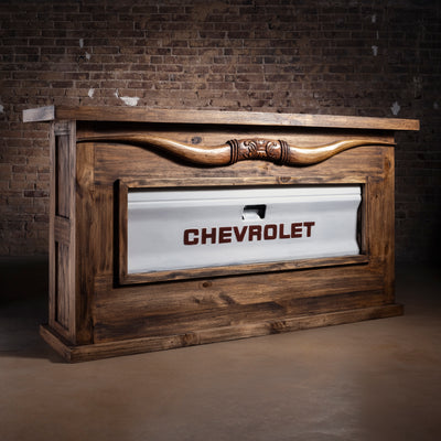 Redstone Bullhorn Tailgate Western Bar Cabinet western bar with Chevrolet tailgate panel, reclaimed wood frame, open shelves, and drawer