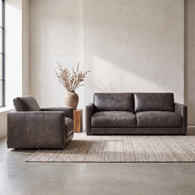 One-only Remington Cowhide Sofa & Swivel Chair Set in top-grain leather. Retail value $12,098, special bundle price $7,999. First come, first served.