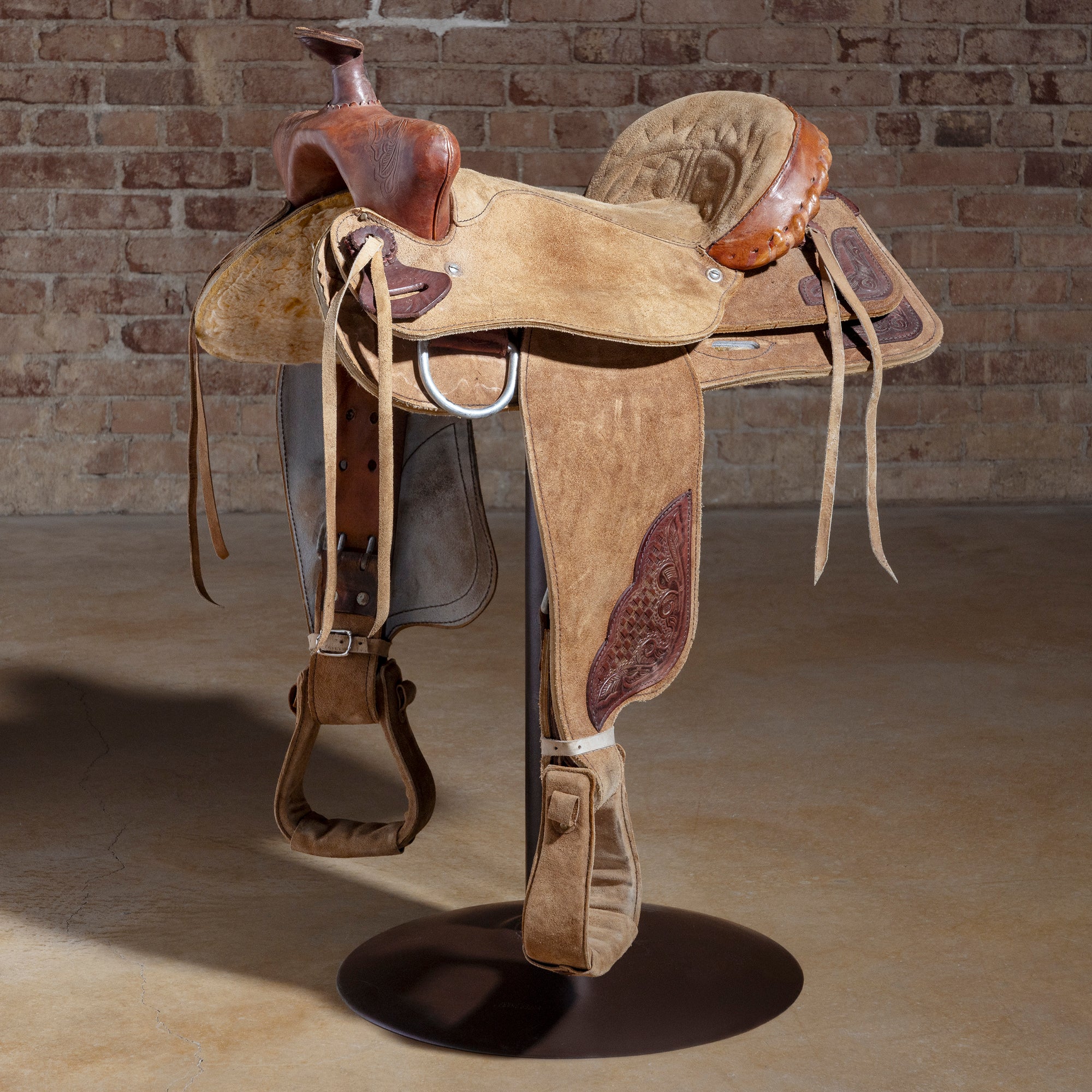 Authentic retired cowboy saddle converted into a one-of-one Western bar stool with iron base — Retired Saddle No. 032
