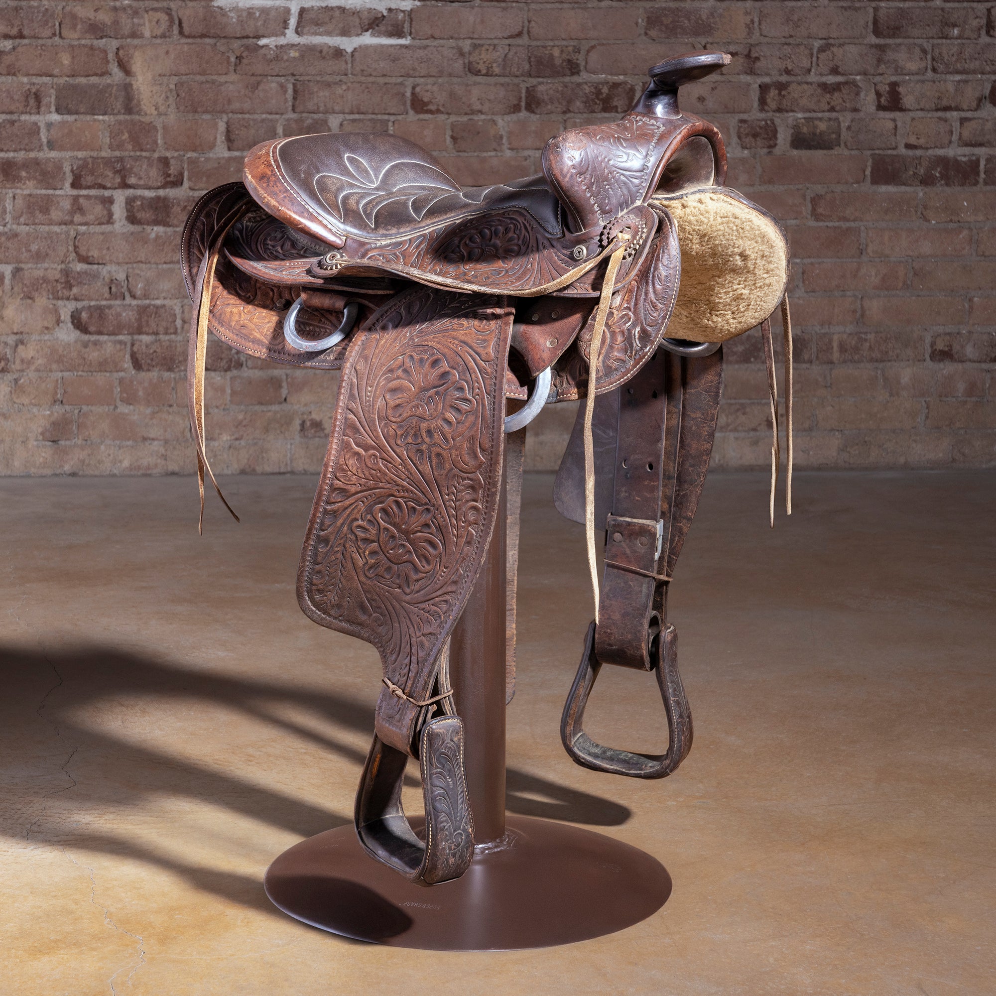 Real retired cowboy saddle stool — handcrafted one-of-one Western bar stool on iron base — Retired Saddle No. 034