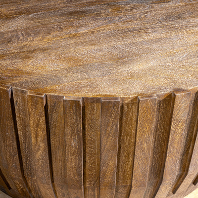 Ridgeline Drum Coffee Table high angle detail showing carved wood ridges, round top, and Western great room character