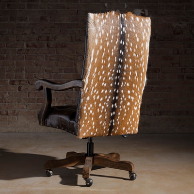 Back view of Western desk chair showing axis hide panel and nailhead trim