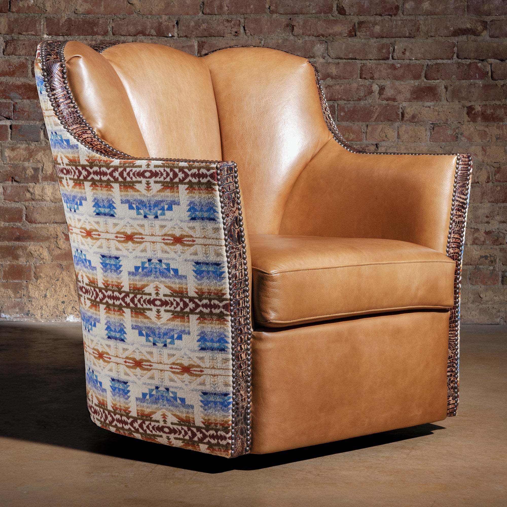 Tan leather and Pendleton fabric Western swivel chair with croc trim – front three-quarter view