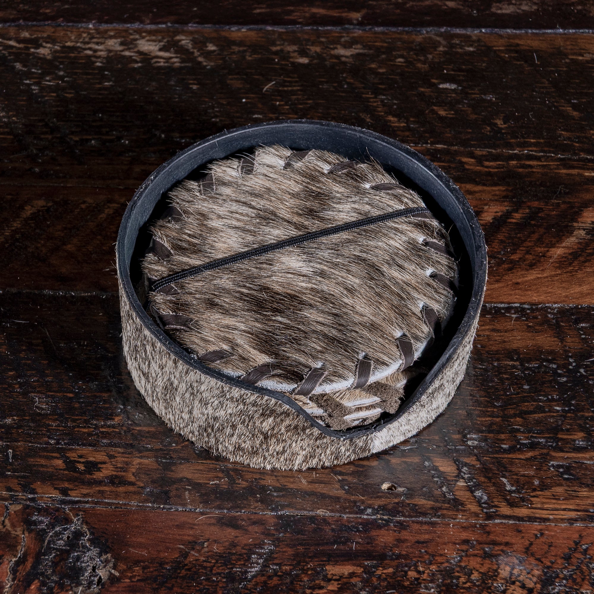 Cowhide coaster set in holder — handcrafted Western home gift under $100.