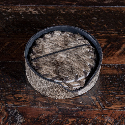 Cowhide coaster set in holder — handcrafted Western home gift under $100.