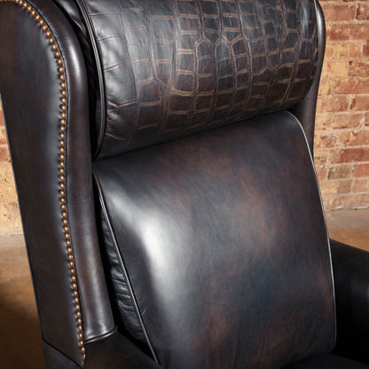 Close-up of high back leather office chair showing croc-embossed headrest panel and smooth leather backrest.