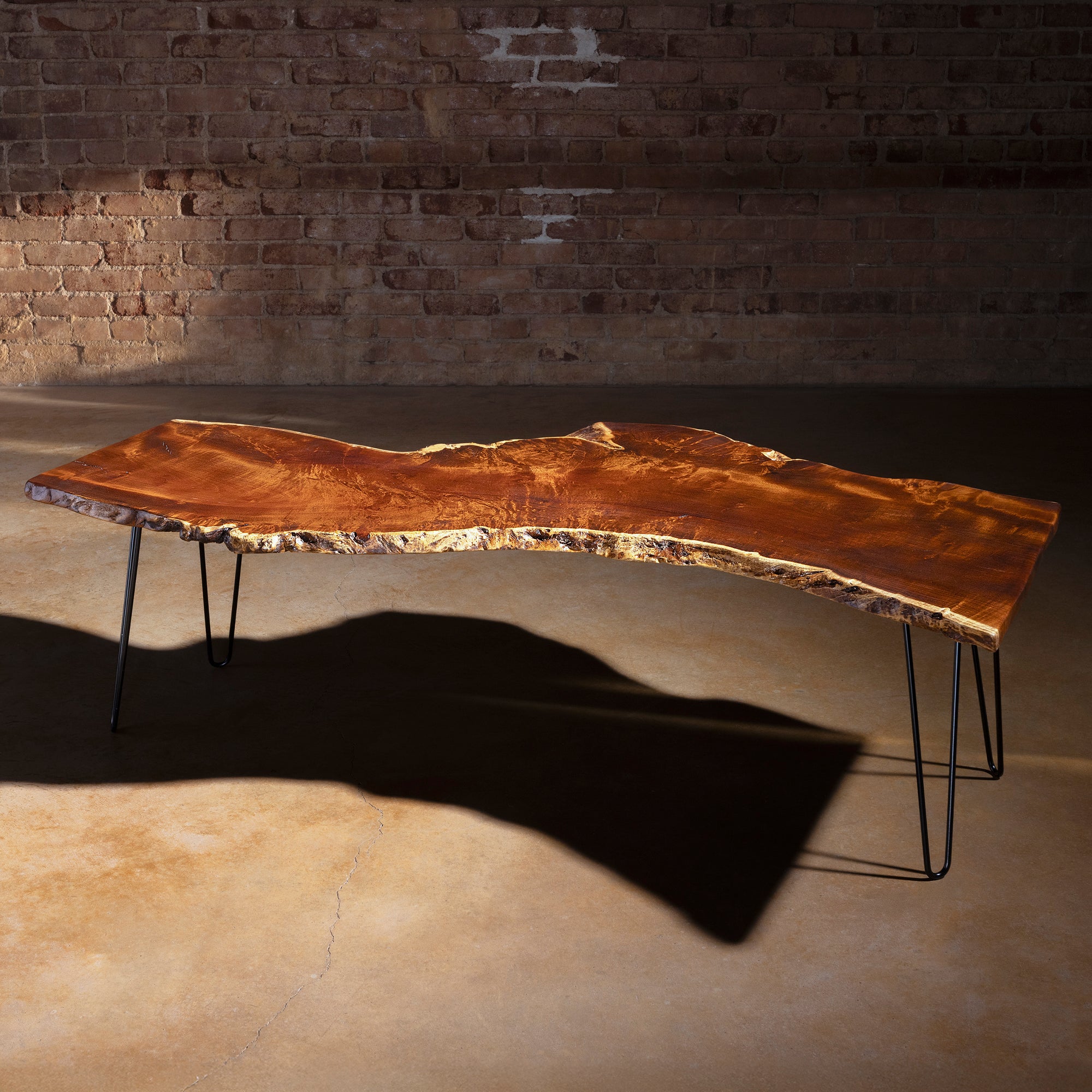 Sable Ridge live-edge walnut coffee table with iron hairpin legs, hero view