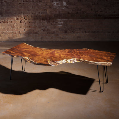 High-angle view showing dramatic walnut grain on Sable Ridge coffee table top