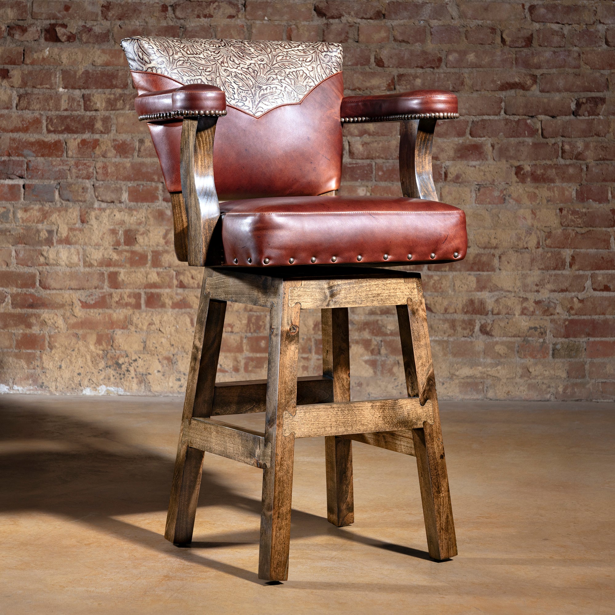 Saddlecrest Tooled Leather Bar Stool with floral-tooled back and chestnut leather seat