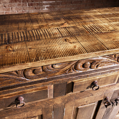 Reclaimed plank wood top close-up with rich grain on Western buffet sideboard