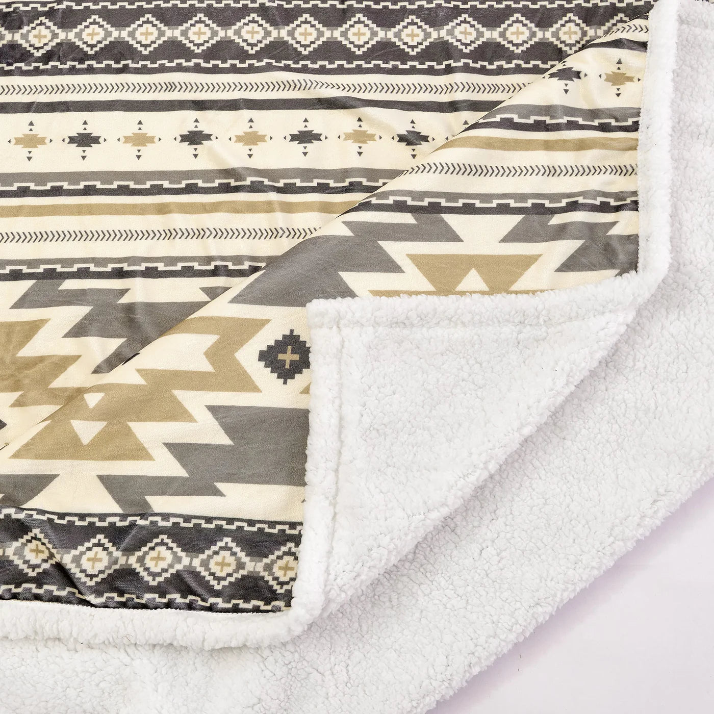 The Sage Campfire Throw is an affordable answer to stylish Southwestern design. Featuring muted Aztec prints and a Sherpa reverse, this lightweight throw provides luxurious comfort and warmth. Perfect for cozy nights at home or around a campfire, this throw offers practicality and stylish sophistication.