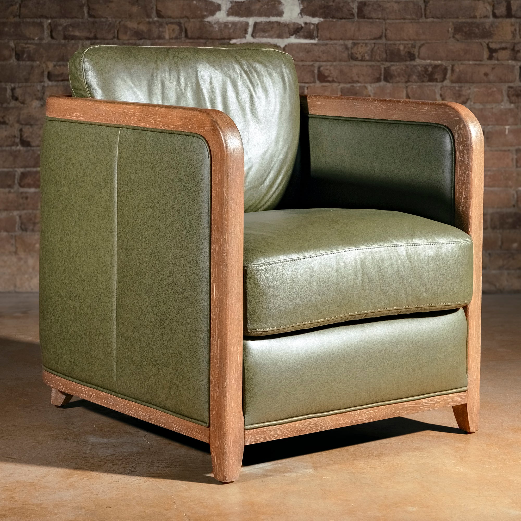 Sagewood Club Chair modern Western accent chair with olive leather panels, rounded wood frame, and ranch-lodge presence