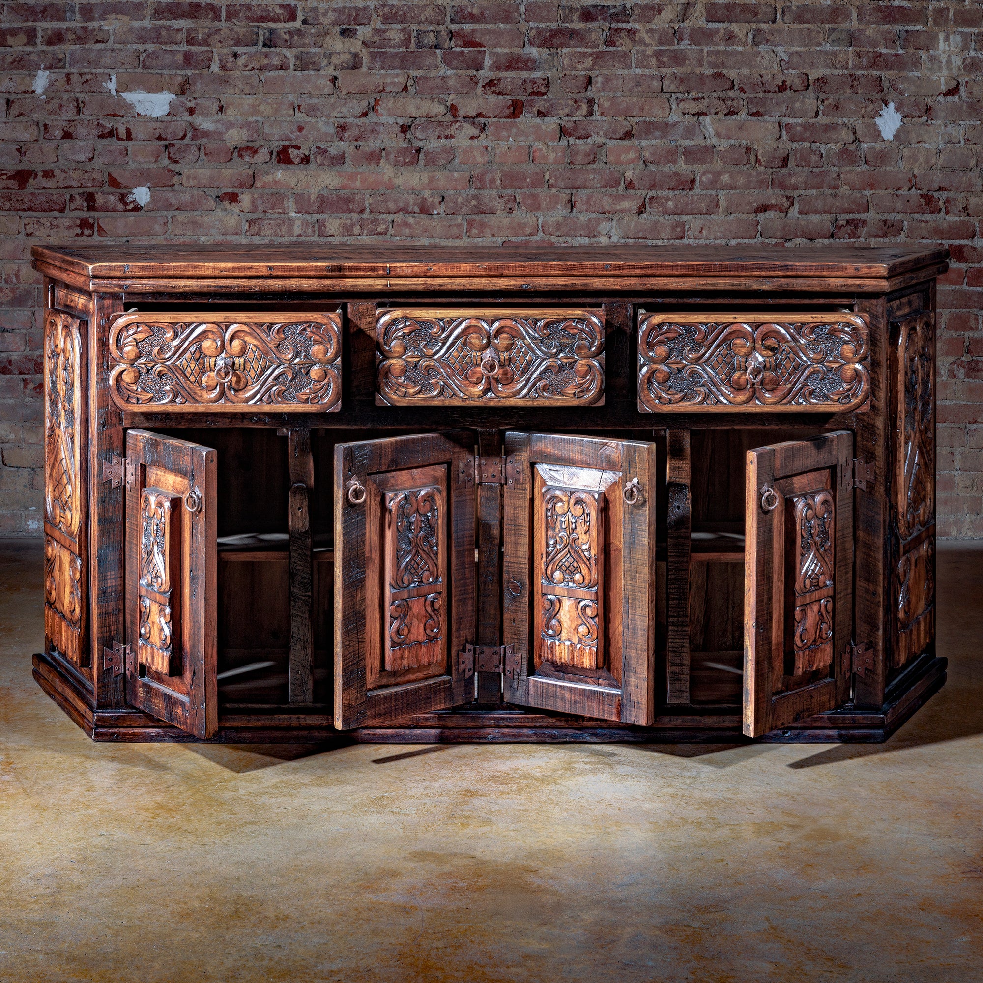 Interior view of San Miguel Western buffet with carved cabinet doors open