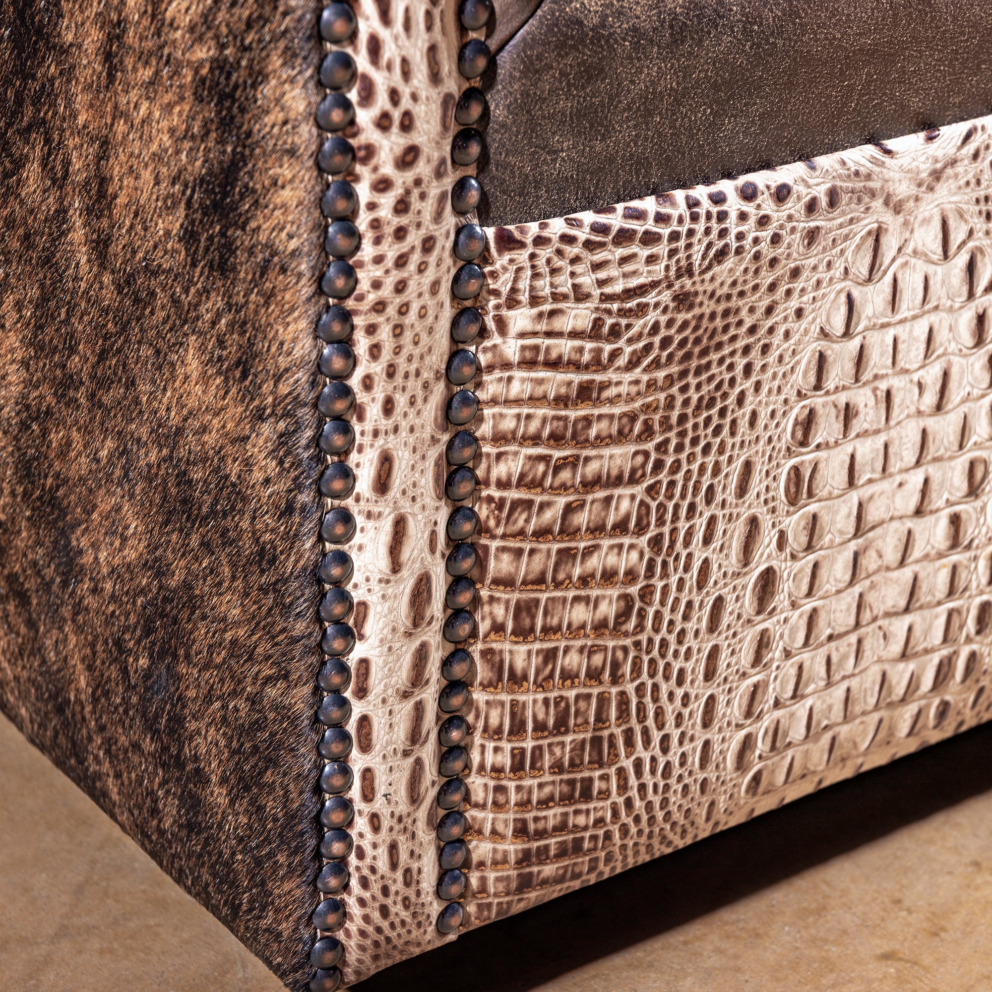Bottom detail of San Saba Bootstitch Swivel Chair showing craftsmanship and base finish