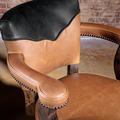 Detail shot of top-grain leather seat and curved armrest of The Santiago Swivel Bar Stool