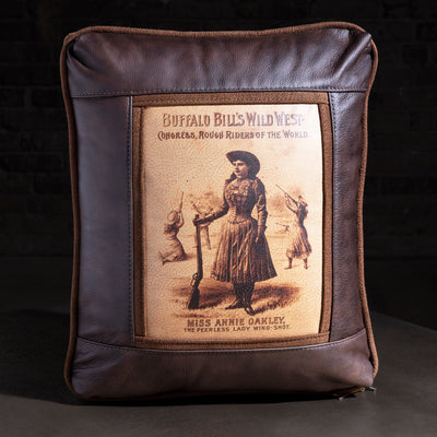 Showbill Sharpshooter Leather Western Throw Pillow western throw pillow with brown leather frame, vintage Wild West poster art, and suede trim