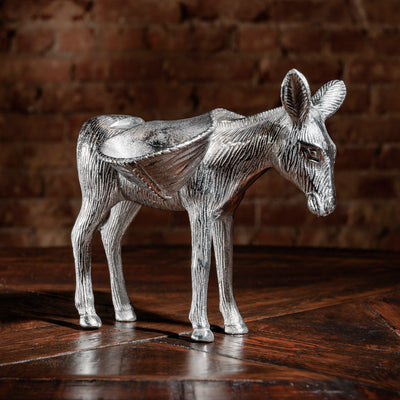 Side view of silver donkey sculpture with saddle-style candy trays