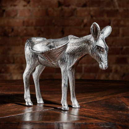 Side view of silver donkey sculpture with saddle-style candy trays