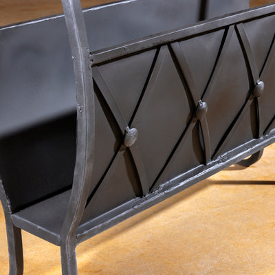 Detailed view of magazine storage and iron craftsmanship on Sierra Forge Table