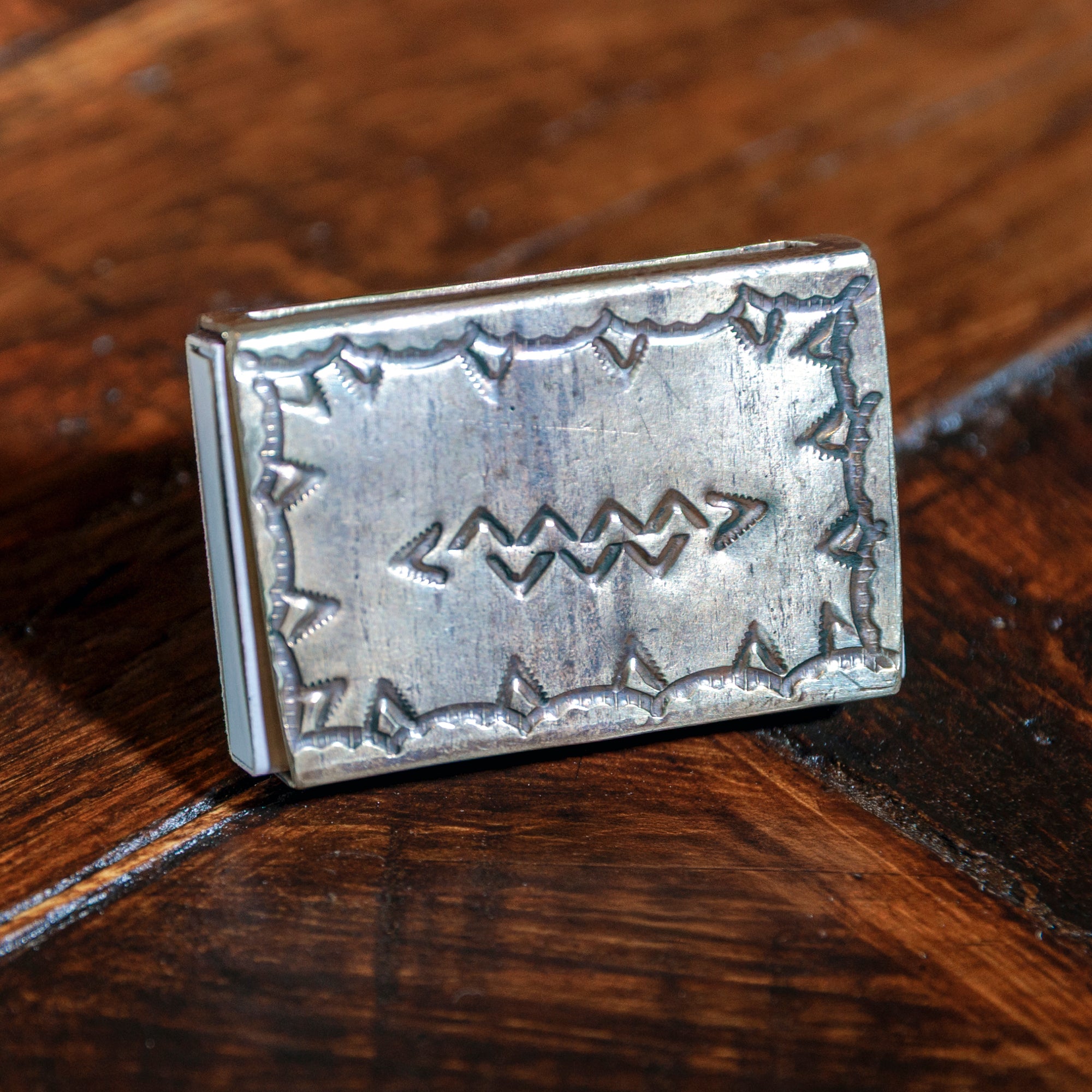 Stamped pattern on the back of the silver turquoise matchbox holder