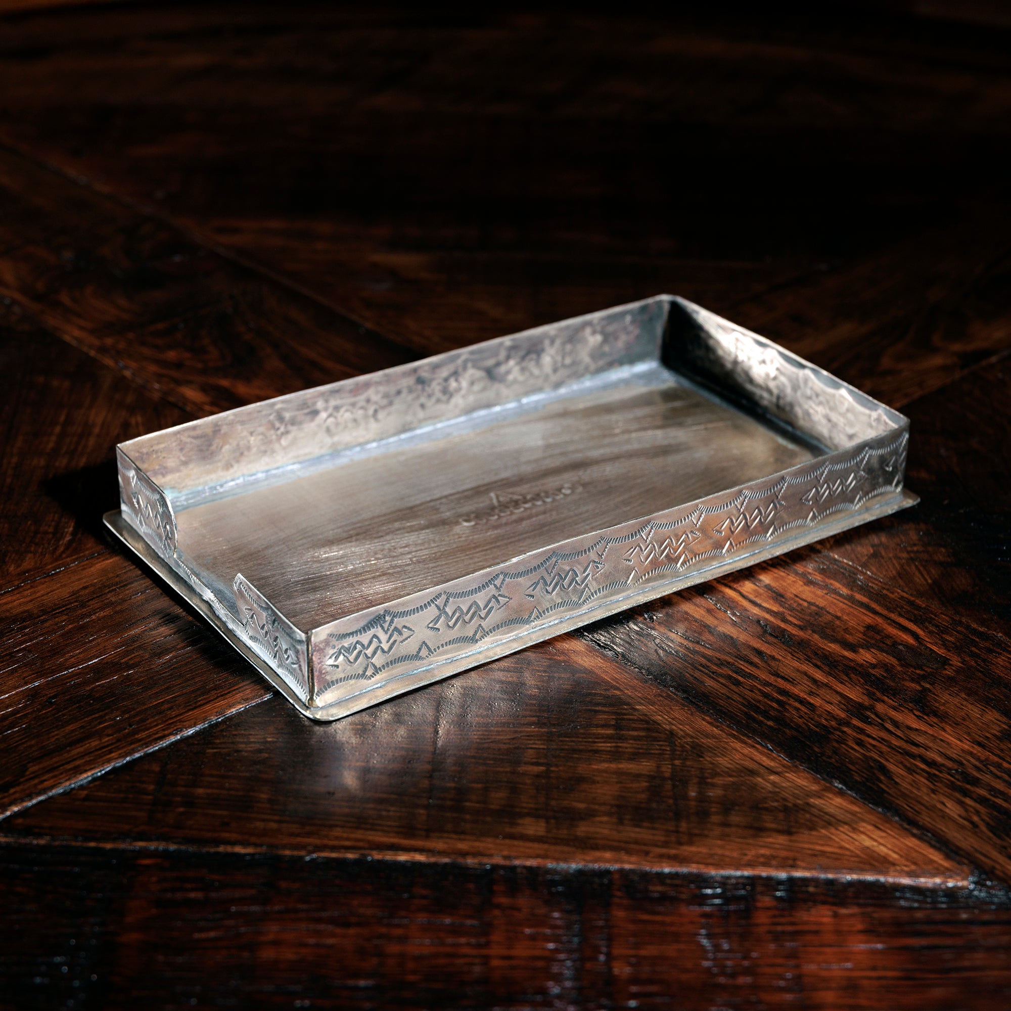 J. Alexander silver napkin holder tray on rustic wood table