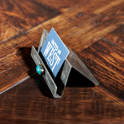 Angled side view of silver card holder by J. Alexander with turquoise accent