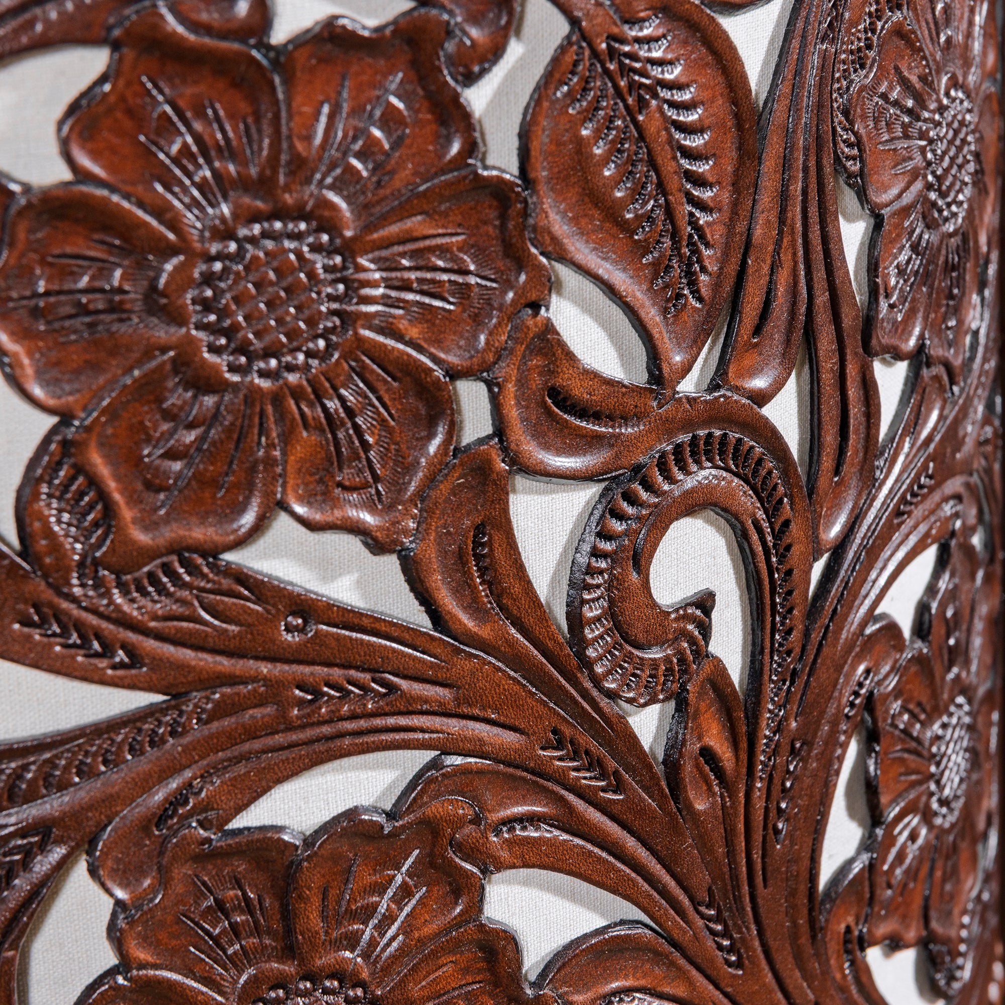 Floral filigree cutwork tooled leather shade detail on Western lamp