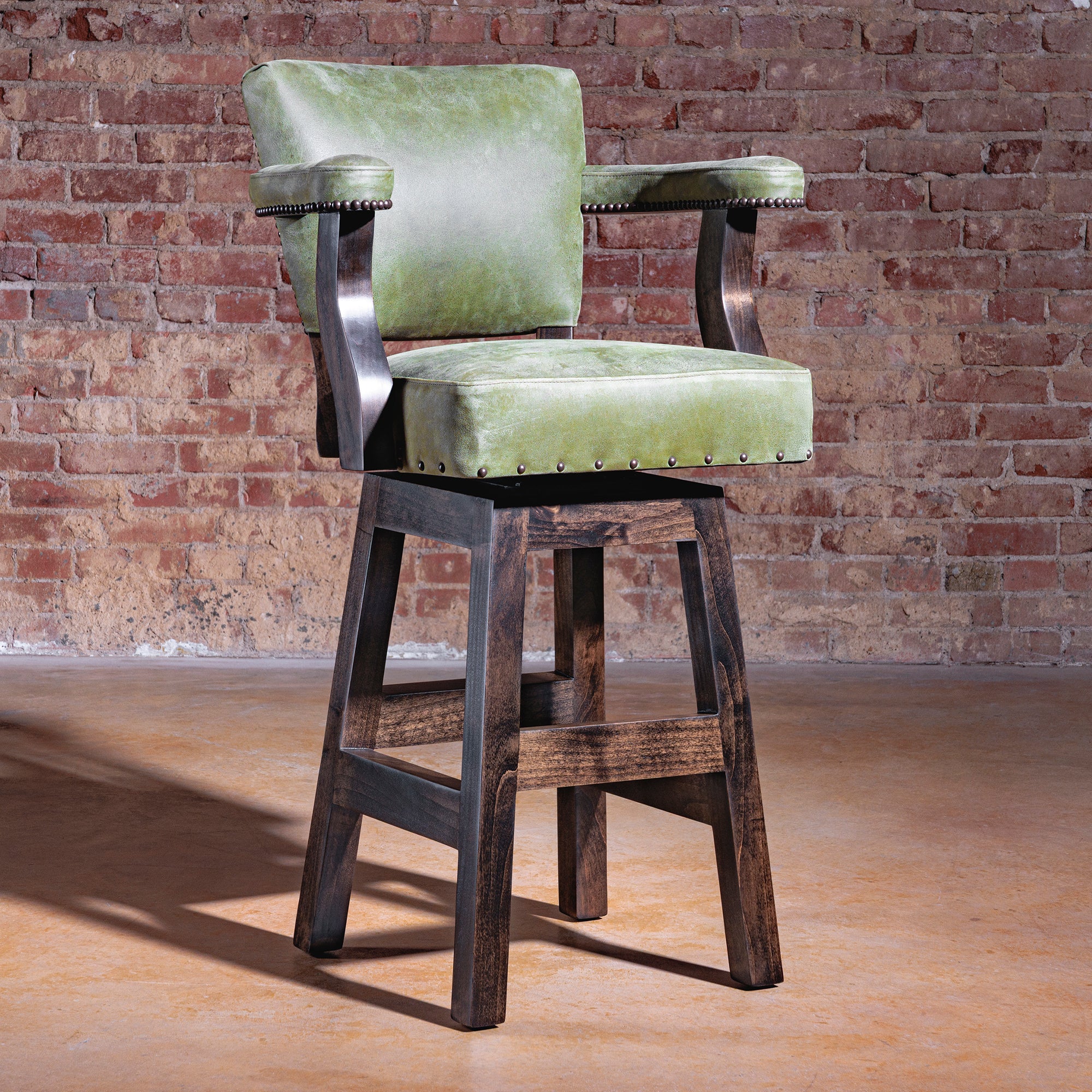 Luxury Western bar stool in sage-green leather with boot-stitch embroidery and alder wood base—Sonora Verde