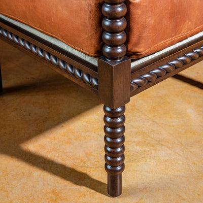 spool-leg-dark-wood-chair-closeup