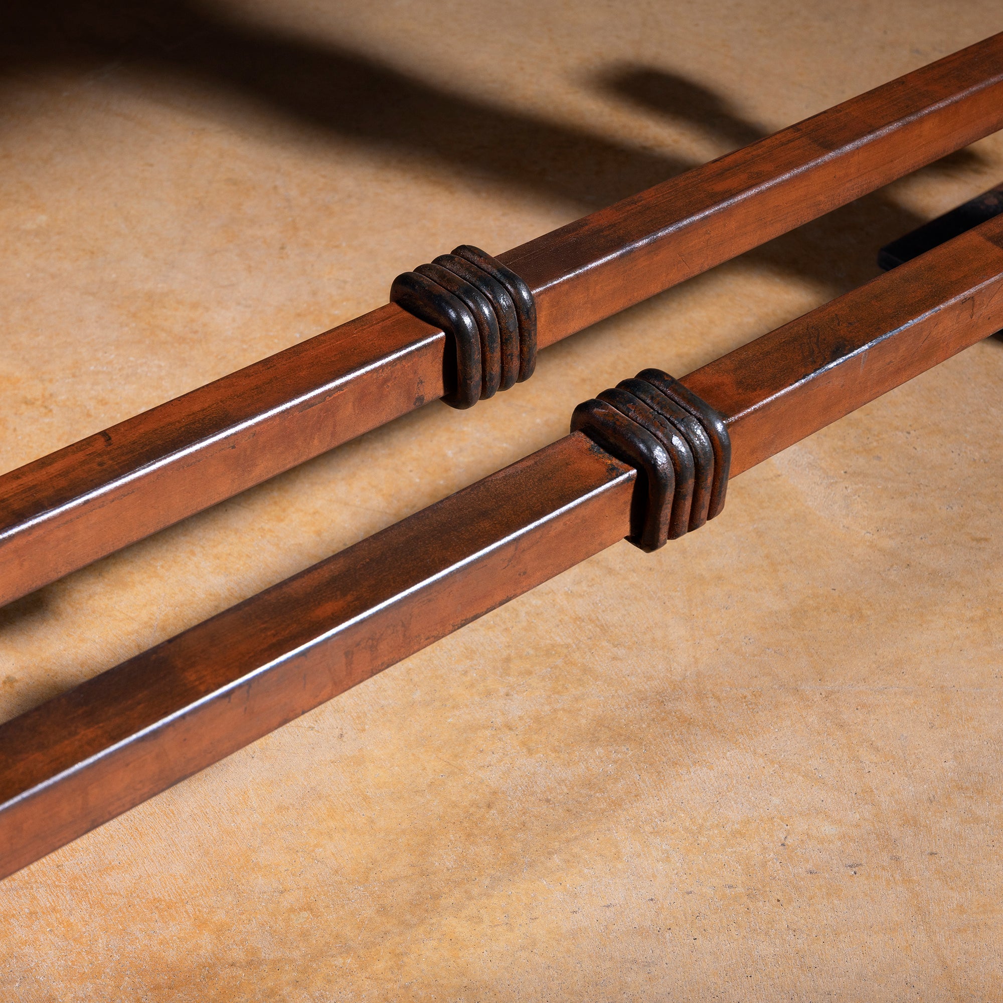 Detail of iron base on the Spur Line Iron Western Console Table